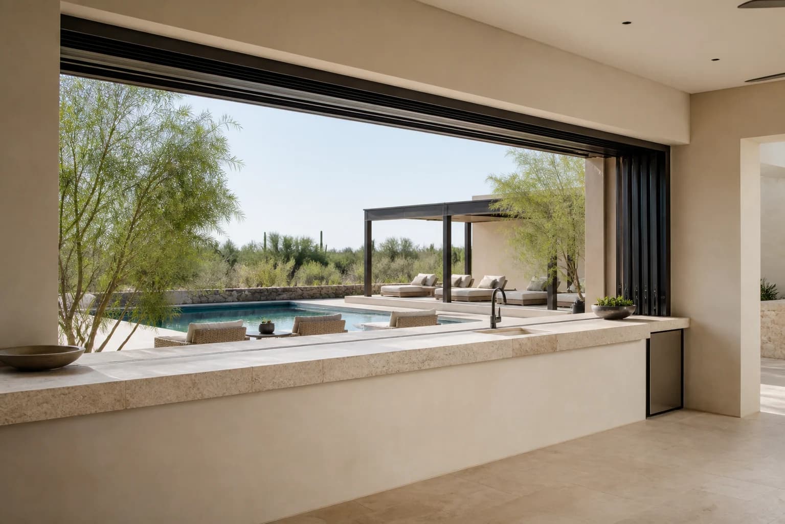 Wide sliding pass-through window opened above a long kitchen counter